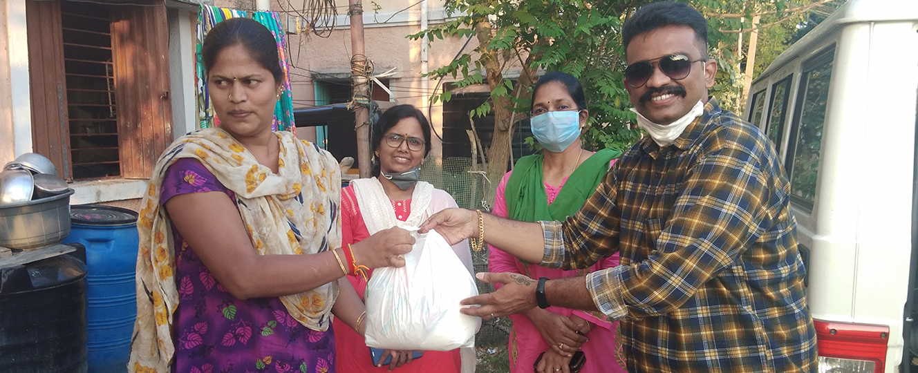 COVID-19 relief — groceries handed to a family